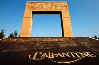 This iconic archway marks the entrance of Ballantyne Village and the community of Ballantyne, a suburb of Charlotte NC located near the South Carolina border. The 2,000-acre mixed-use development was created by land developer Howard C. Smokey Bissell.